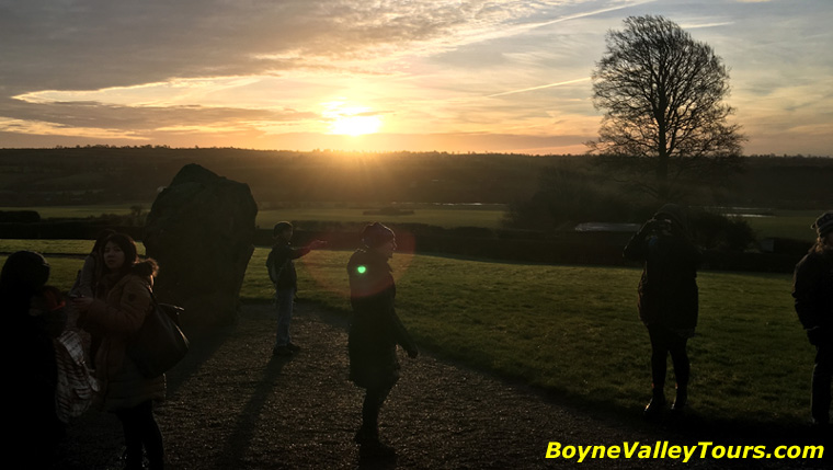 The rising sun soon cleared the cloud to bath Newgrange in golden light.