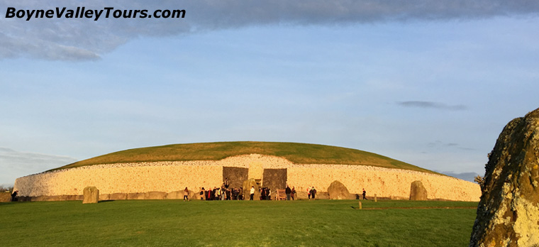 The white quartz on the Newgrange mound glows in the sunlight. 